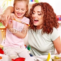 Child_painting_at_easel..jpg