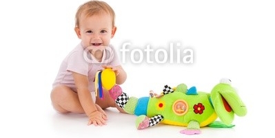 Happy_toddler_playing_with_toy.jpg
